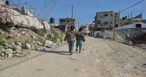 Children walking on road in Gaza