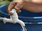 Woman turns on tap for clean water in Sri Lanka