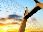 image of a bridge at sunset. Photo credit shutterstock/ gyn9037 