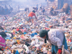 People pick through a garbage dump.  Image credit: Stockbyte via Getty Images. 