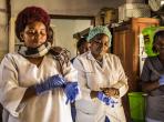 16 January 2019 - Beni, Democratic Republic of Congo.  Health workers put their gloves on before checking patients at the hospital. Photo credit: World Bank / Vincent Tremeau